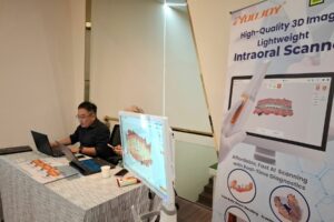 Medik-Link's booth at the Sebaris Aligner Course featuring youjoy intraoral scanner