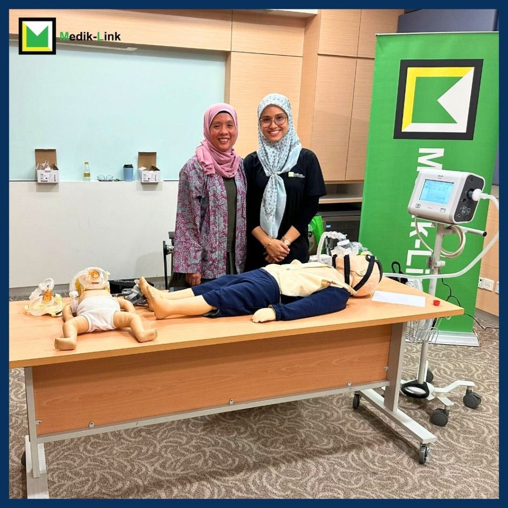 Dr Maira and Medik-Link product specialist supporting hands-on NIV training using the Philips Trilogy EV300 ventilator during a PICU workshop in Malaysia